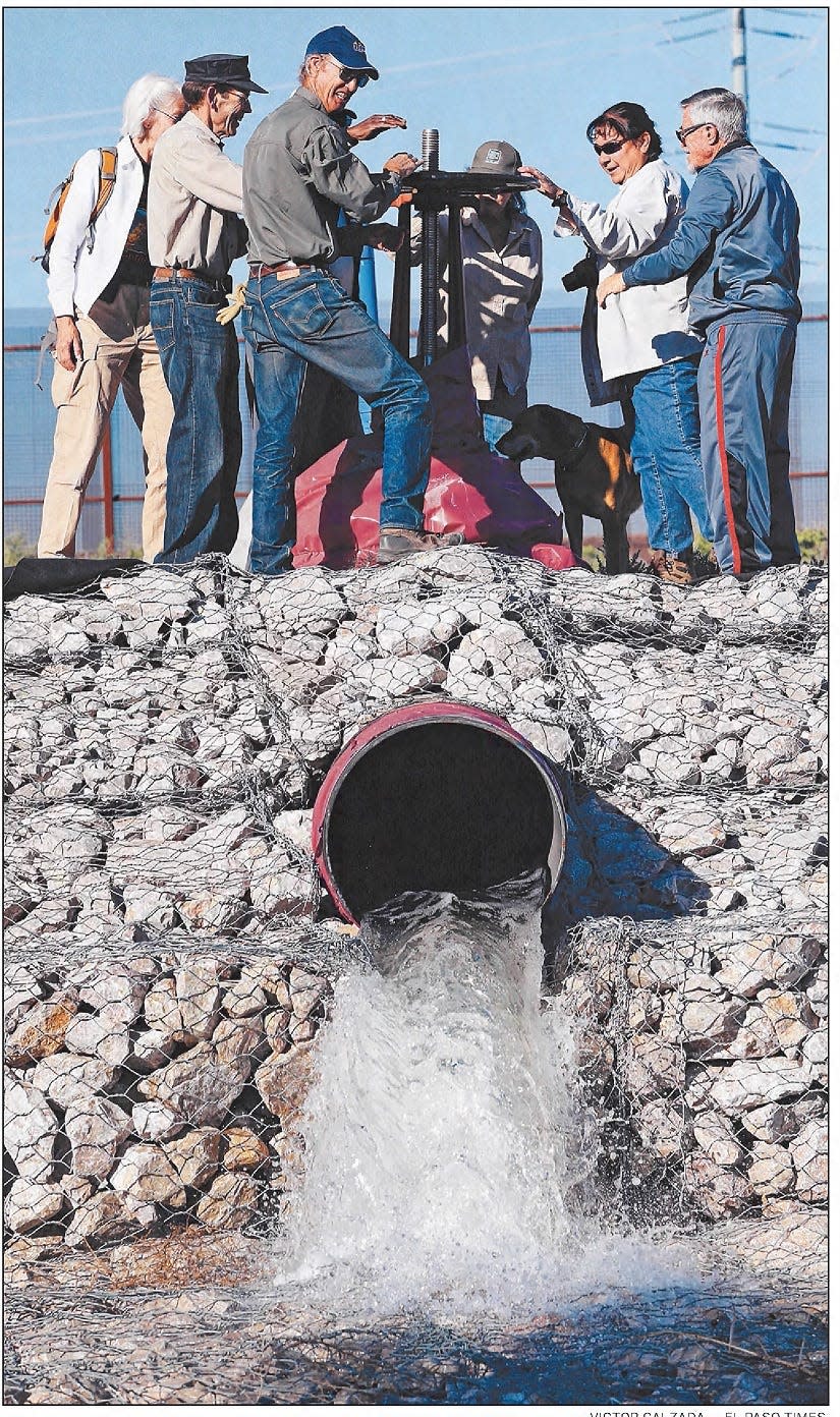 May 2, 2015: John Sproul, manager of the Rio Bosque Wetlands Park, center, is joined by other dignitaries as they turn a valve to release water from the Robert R. Bustamante Wastewater Treatment Plant through a new pipeline into the wetlands park.