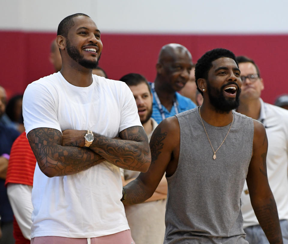 Carmelo Anthony (L) and Kyrie Irving laugh as they attend a practice session at the 2018 USA Basketball Men’s National Team minicamp at the Mendenhall Center at UNLV on July 27, 2018 in Las Vegas. (Photo by Ethan Miller/Getty Images)