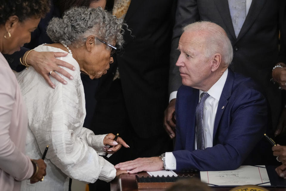 Ninety-four-year-old activist and retired educator Opal Lee, speaks with President Joe Biden after he signed the Juneteenth National Independence Day Act into law in the East Room of the White House on June 17, 2021 in Washington, D.C.  / Credit: Drew Angerer / Getty Images