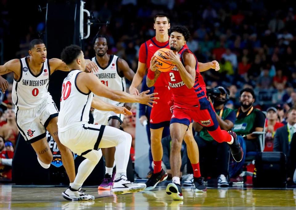 San Diego State Aztecs guard Matt Bradley (20) defends Florida Atlantic Owls guard Nicholas Boyd (2) during the first half of the Men’s Basketball Championship National Semifinal at NRG Stadium in Houston, Texas on Saturday, April 1, 2023.