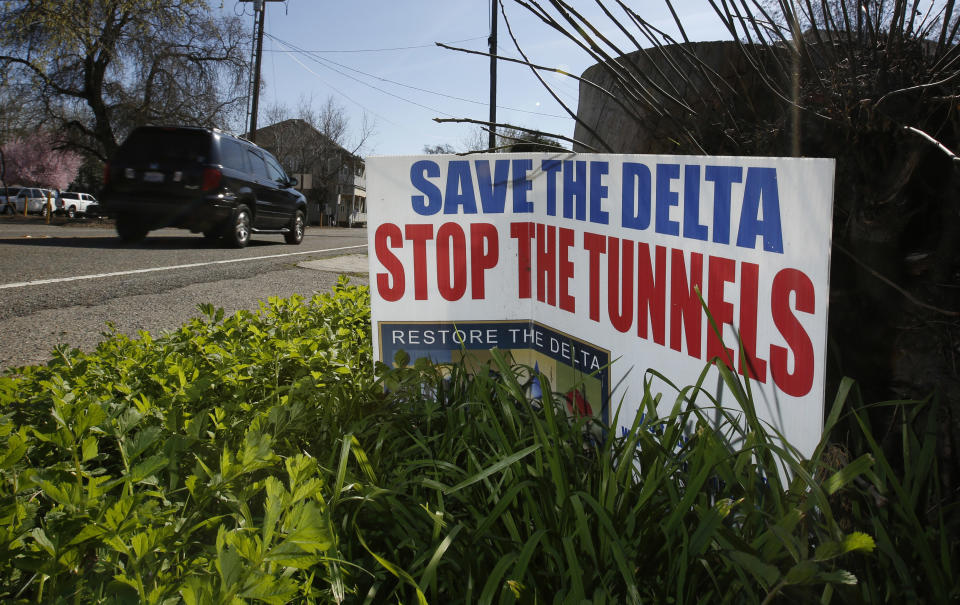 FILE - In this Feb. 23, 2016, file photo, a sign opposing a proposed plan by Gov. Jerry Brown to build two giant tunnels to ship water through the Sacramento-San Joaquin Delta to Southern California is displayed near Freeport, Calif. Gov. Gavin Newsom officially abandoned his predecessor's plan, Thursday, May 2, 2019, opting instead for just one, smaller tunnel. (AP Photo/Rich Pedroncelli, File)