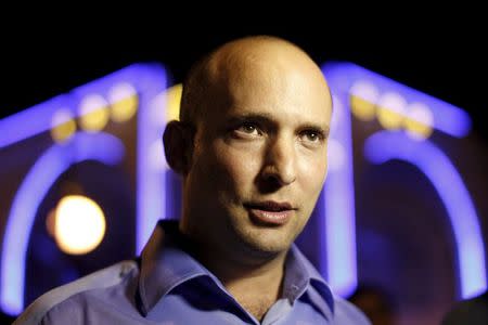 Naftali Bennett, head of the Beit Yehudi party, campaigns at a bar in Ashdod in this December 27, 2012 file photo. REUTERS/Amir Cohen/Files