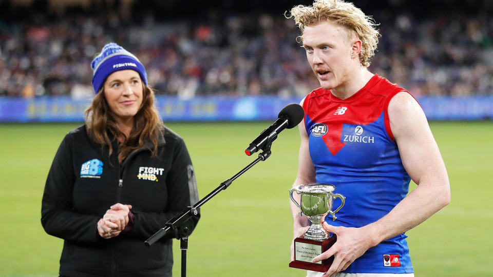 Clayton Oliver, pictured here with the Neale Daniher Trophy after Melbourne's loss to Collingwood.