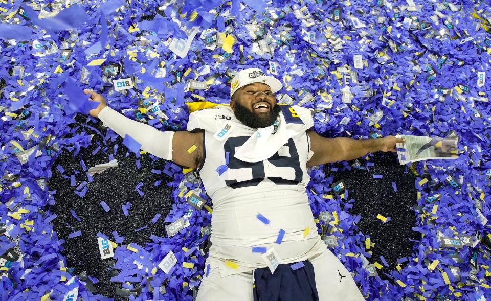 Michigan defensive lineman Cam Goode celebrated Saturday's win against Iowa for the Big Ten title.