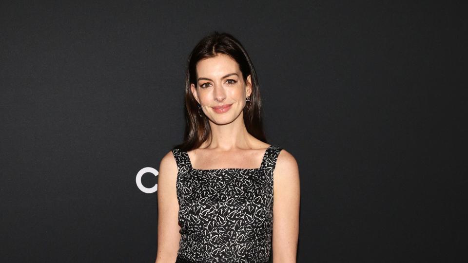 new york, new york december 14 anne hathaway, wearing chanel, attends the museum of modern art film benefit presented by chanel, a tribute to penélope cruz, at museum of modern art on december 14, 2021 in new york city photo by jamie mccarthywireimage