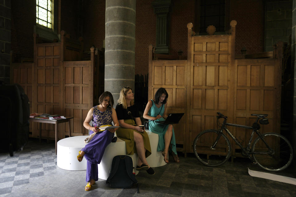 Confessional booths are stacked into a corner at the Sacred Heart church in Mechelen, Beligum, Monday, June 19, 2023. Across Europe, the continent that nurtured Christianity for most of two millennia, many churches, convents, beguinages and chapels stand empty as faith and church attendance have dwindled over the past half century. Many are now been repurposed to preserve their historical and architectural relevance, while others have opened up to non-religious activities to expand their use. (AP Photo/Virginia Mayo)