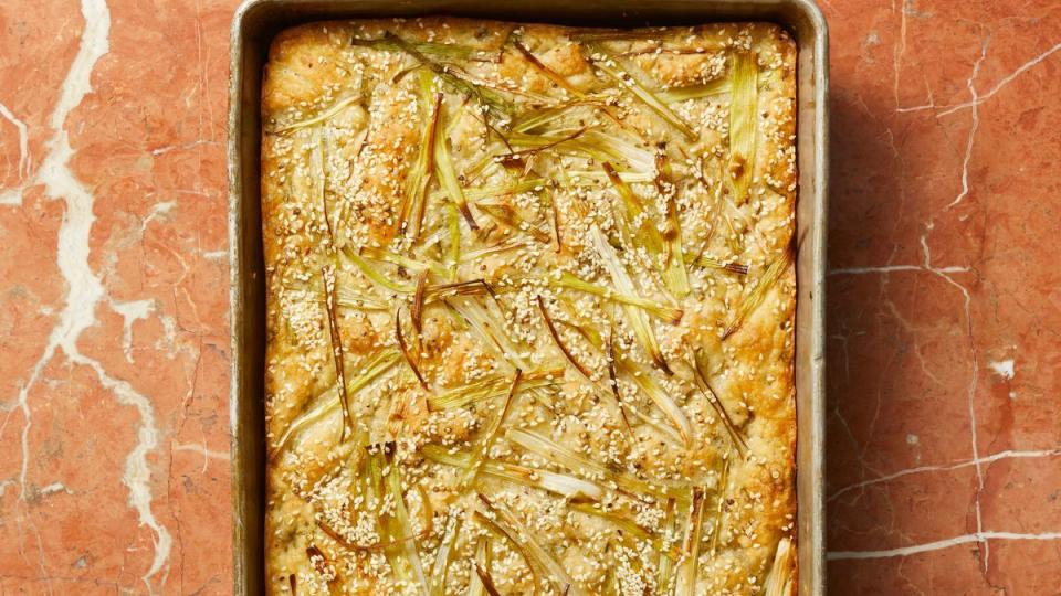 scallion and sesame focaccia in a deep sheet pan