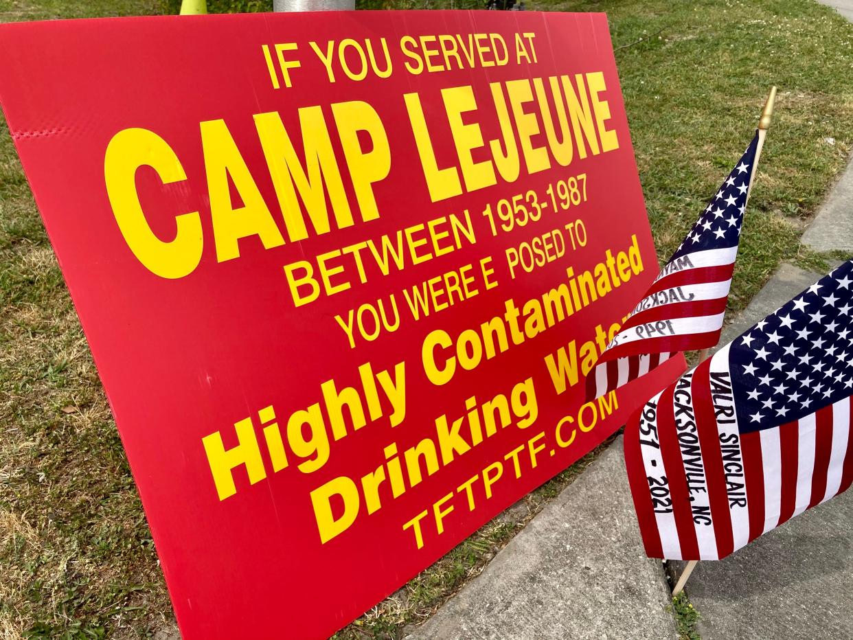 Mini American flags displayed in memory of lives lost at a Camp Lejeune toxic water survivors outreach event held in Jacksonville, N.C., Tuesday, April 20, 2021.