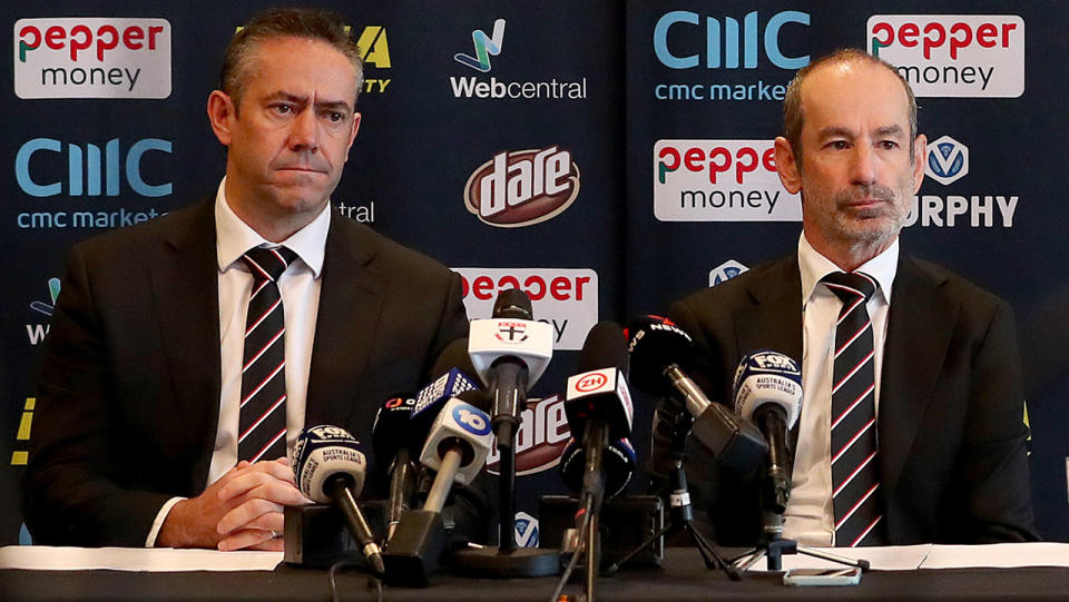 Simon Lethlean and Andrew Basset sit side by side at a press conference.