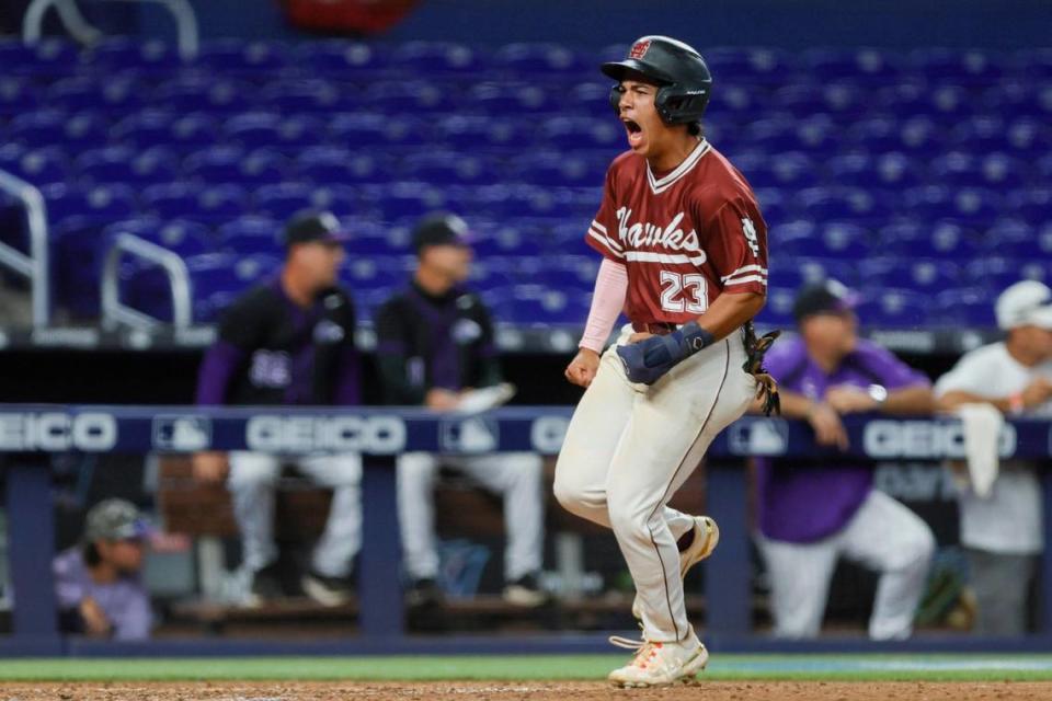 Miami Springs Hawks Richard Piloto (23) reacts o his way to home plate after an RBI triple from Gio Cutino (not pictured) against the Southwest Miami Eagles during the sixth inning of a high school baseball game part of the Field of Dreams Program at loanDepot park in Miami, Florida, Tuesday, April 11, 2023. The Field of Dreams Program gives local high school baseball teams the opportunity to play a game at loanDepot park.