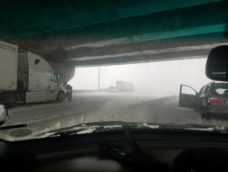 Vehicles are seen stranded along Interstate 25 near Lone Tree, Colorado, U.S. in this March 13, 2019 handout photo. City of Lone Tree, Colo./Handout via REUTERS