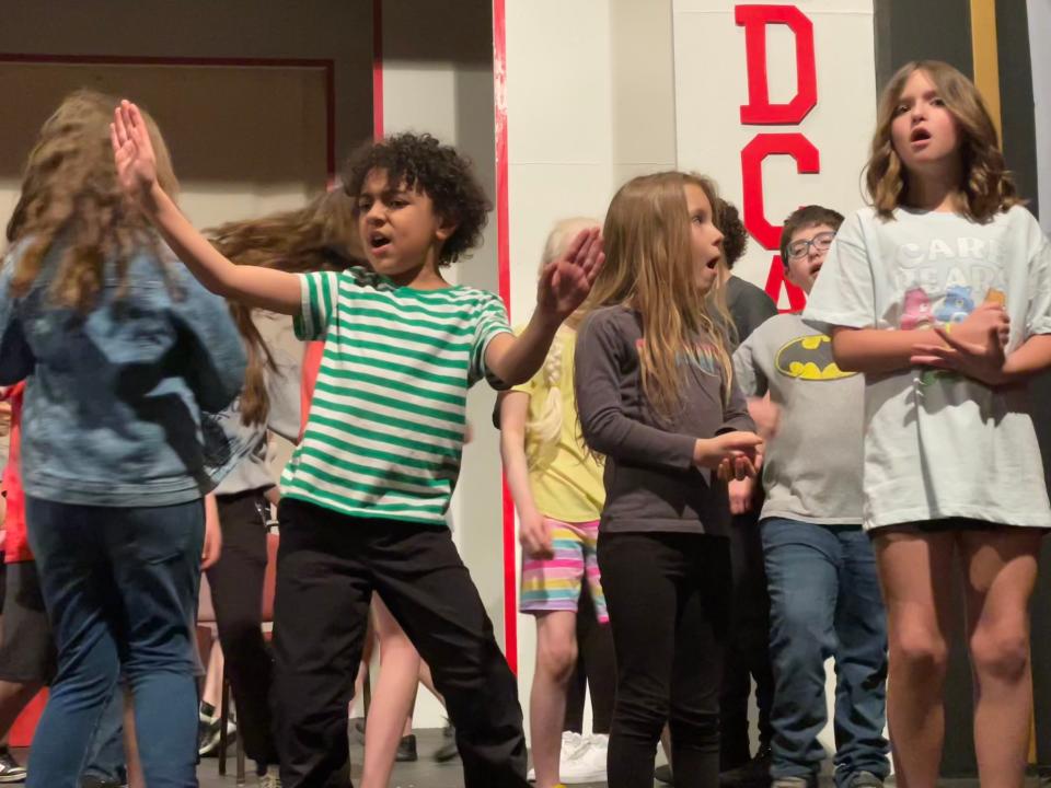 Young actors practice performing 'High School Musical' for the New Castle Playhouse stage.