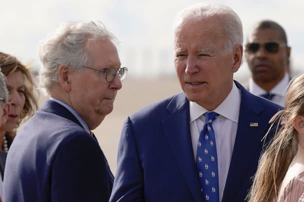 PHOTO: Mitch McConnell looks to President Joe Biden after Biden arrived at Cincinnati/Northern Kentucky International Airport in Hebron, Ky., Jan. 4, 2023. (Patrick Semansky/AP, FILE)