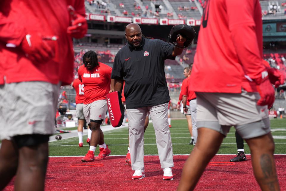 Sep 16, 2023; Columbus, Ohio, USA; Ohio State Buckeyes defensive line coach Larry Johnson warms up players prior to the NCAA football game against the Western Kentucky Hilltoppers at Ohio Stadium.