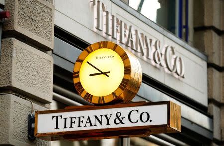 A clock is placed in front of a store of U.S. jeweller Tiffany at the Bahnhofstrasse shopping street in Zurich in this file photo from December 23, 2013. REUTERS/Arnd Wiegmann
