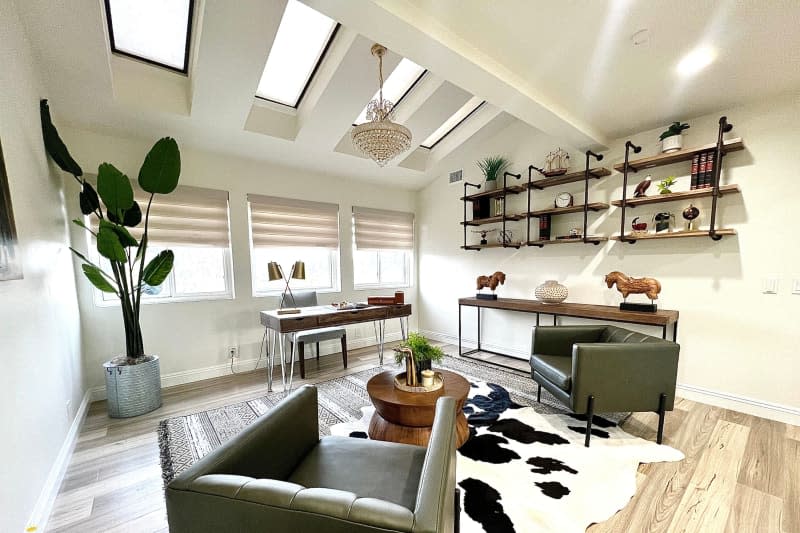 Leather armchairs in staged home office.