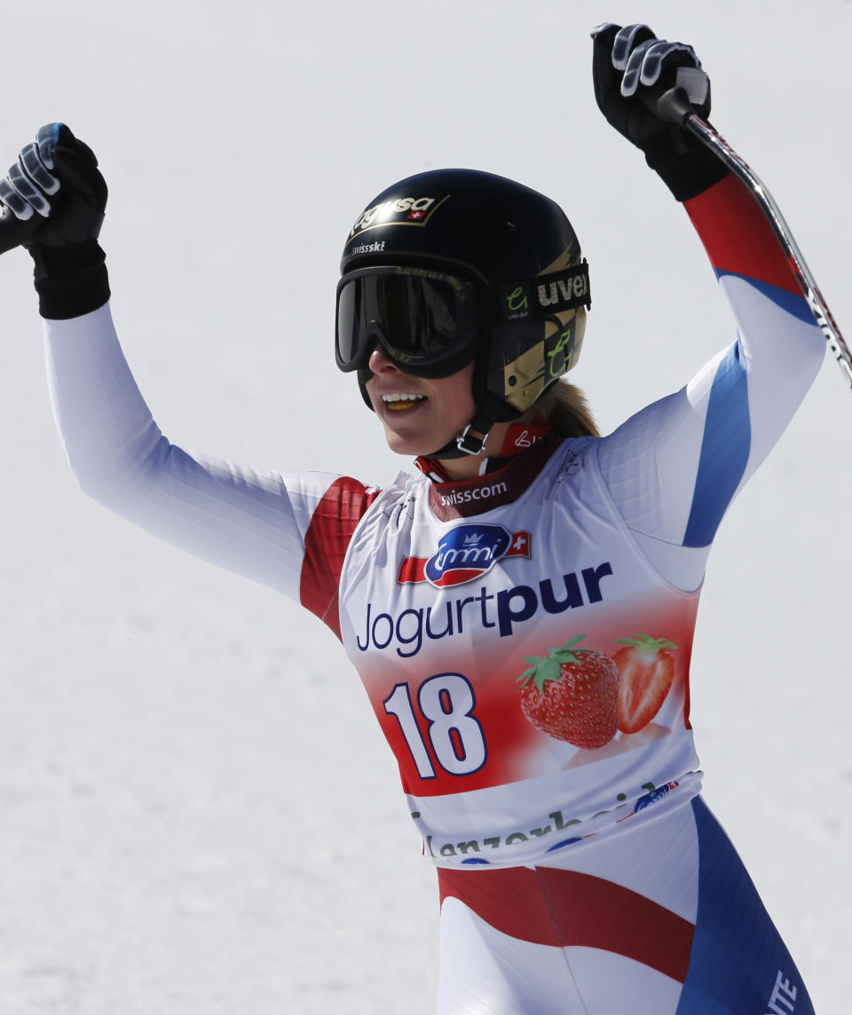 Switzerland's Lara Gut celebrates winning a women's alpine skiing downhill at the World Cup finals in Lenzerheide, Switzerland, Wednesday, March 12, 2013. (AP Photo/Marco Trovati)