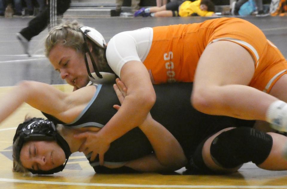 Heath sophomore Megan DeVito earns a takedown of River Valley senior Shayla Pappert in their 120-pound match during the Watkins Girls Wrestling Invitational on Wednesday, Dec. 28, 2022.