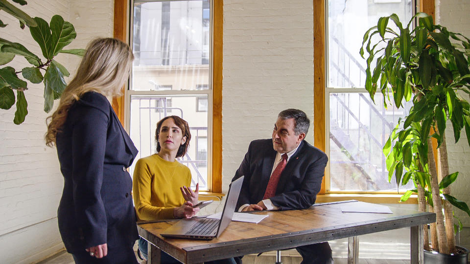 Abby Grossberg, center, with lawyers Kimberly Catala and Gerry Filippatos. (NBC News)