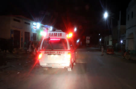 Aamin ambulance drives from the scene of an explosion near the Presidential palace in Mogadishu, Somalia February 23, 2018. REUTERS/Feisal Omar