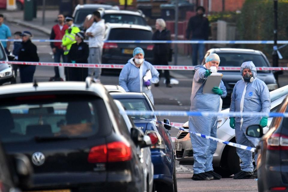 Police in Wood Green after the stabbing (PA)