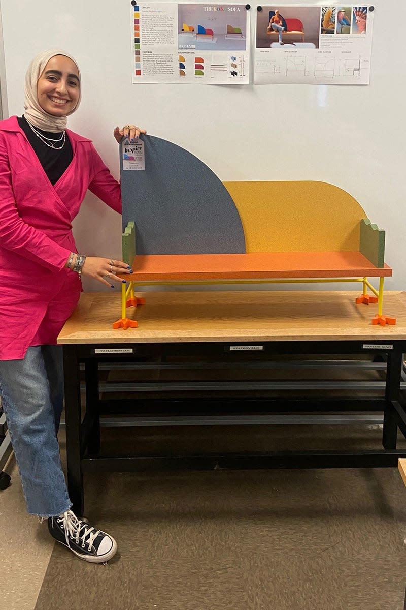 Middle Tennessee State University junior interior design student Leen Hasan from Murfreesboro, Tennessee, stands with her project titled Koko Sofa which earned second place at Formica Form, a national furniture design competition that held regional awards at the Inspire Nashville trade show. As part of the experiential learning, or EXL, capstone course taught by assistant professor Carrie Pavel, students designed a piece of furniture that utilizes Formica as a material in the project based on the theme of maximalism.