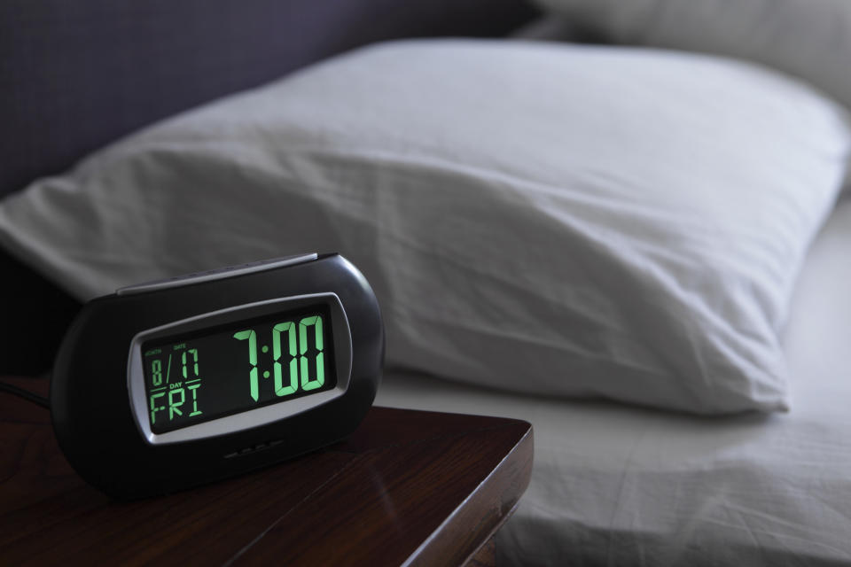 Alarm clock by bedside. Source: Getty Images