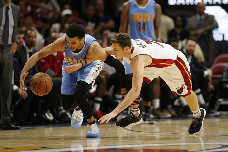 The Nuggets and Heat are both hustling to try to score their conference&#39;s final playoff spot. (AP)