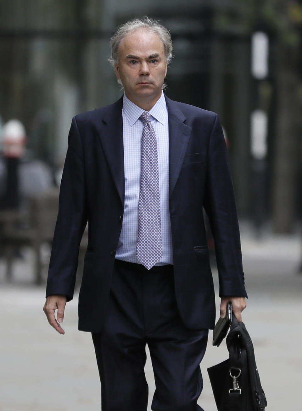 Justin Rushbrooke QC who is representing Meghan, the Duchess of Sussex arrives at the High Court in London, Monday, Sept. 21, 2020. The next stage in the Duchess of Sussex's legal action against a British newspaper over its publication of a "private and confidential" letter to her estranged father is due to be heard at the High Court. (AP Photo/Kirsty Wigglesworth)