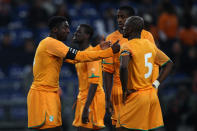 Ivory Coast's Kolo Toure (left) talks to team mates Yaya Toure (centre) and Didier Zokora.