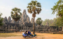 <p><strong>What to See: </strong>The 12th-century <a rel="nofollow noopener" href="http://www.travelandleisure.com/articles/angkor-wat-behavior-video" target="_blank" data-ylk="slk:Angkor Wat;elm:context_link;itc:0;sec:content-canvas" class="link ">Angkor Wat</a> is the largest religious monument in the world, filling an area of over 400 acres. Built originally as a temple to the Hindu god Vishnu, over the period of its construction the complex gradually became Buddhist. Its incredible grandeur is a testament to human accomplishment. (UNESCO agrees.)</p><p><strong>Where to Stay: </strong>The <a rel="nofollow noopener" href="http://www.goldentempleresidence.com/home" target="_blank" data-ylk="slk:Golden Temple Residence;elm:context_link;itc:0;sec:content-canvas" class="link ">Golden Temple Residence</a> provides a luxurious haven after a long day of tromping around outdoors. Cool down with a cocktail in their swim-up bar.</p><p><strong>What to Eat: </strong><a rel="nofollow noopener" href="https://www.facebook.com/GenevievesRestaurant#_=_" target="_blank" data-ylk="slk:Genevieves;elm:context_link;itc:0;sec:content-canvas" class="link ">Genevieves</a> offers both local Khmer and international Western dishes, both to great acclaim.</p>