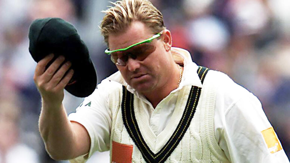 Shane Warne, pictured here with his baggy green cap in 2001.