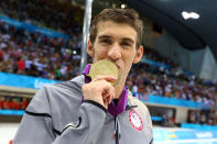 Gold medallist Michael Phelps of the United States kisses his medal following the medal ceremony for the Men's 4x100m medley Relay Final on Day 8 of the London 2012 Olympic Games at the Aquatics Centre on August 4, 2012 in London, England. (Photo by Al Bello/Getty Images)