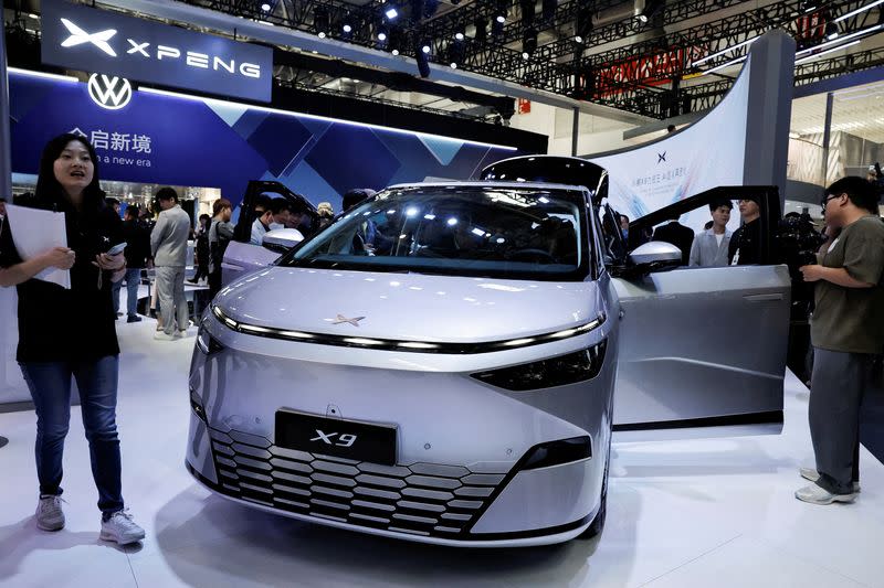 FILE PHOTO: Tesla's self-driving bid for China faces rivals racing ahead