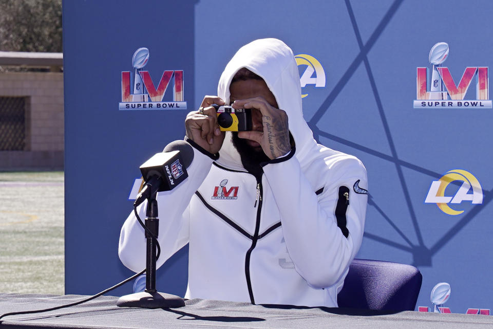 Los Angeles Rams wide receiver Odell Beckham Jr. takes a picture of the media during a media availability for an NFL Super Bowl football game Friday, Feb. 11, 2022, in Thousand Oaks, Calif. The Rams are scheduled to play the Cincinnati Bengals in the Super Bowl on Sunday. (AP Photo/Mark J. Terrill)