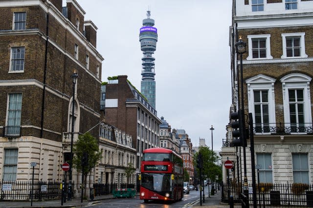 A digital message, which reads “Less URL, more IRL. Welcome back.” is displayed on the BT Tower Infoband, 190 metres above the streets of London as BT marks the latest phase of the Government’s Covid-19 lockdown measures easing (Anthony Upton/PA)