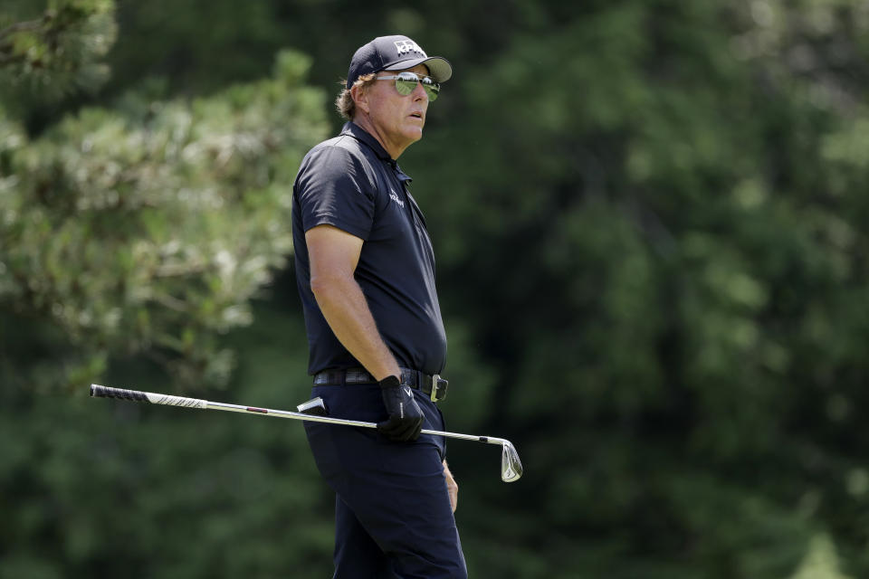 Phil Mickelson looks at his tee shot from the fifth hole during the final round of the Travelers Championship golf tournament at TPC River Highlands, Sunday, June 28, 2020, in Cromwell, Conn. (AP Photo/Frank Franklin II)