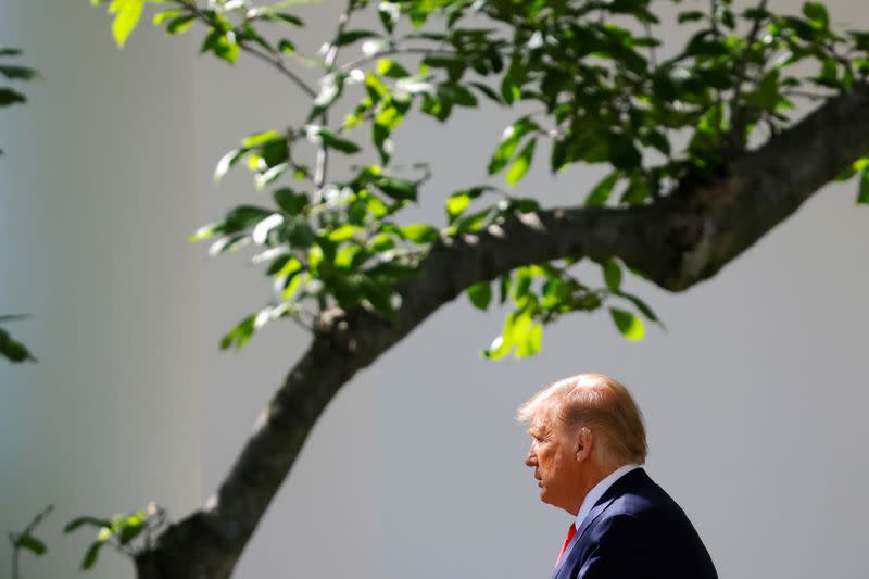 U.S. President Donald Trump exits the Oval Office as he departs on campaign travel to Minnesota from the South Lawn at the White House in Washington, U.S.