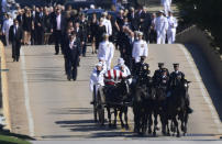 <p>Family members, including Cindy McCain, back center, follow a horse-drawn caisson carries the casket of Sen. John McCain, R-Ariz., as it proceeds to the United States Naval Academy cemetery in Annapolis, Md., Sunday, Sept. 2, 2018, for burial. (Photo: Susan Walsh/AP) </p>