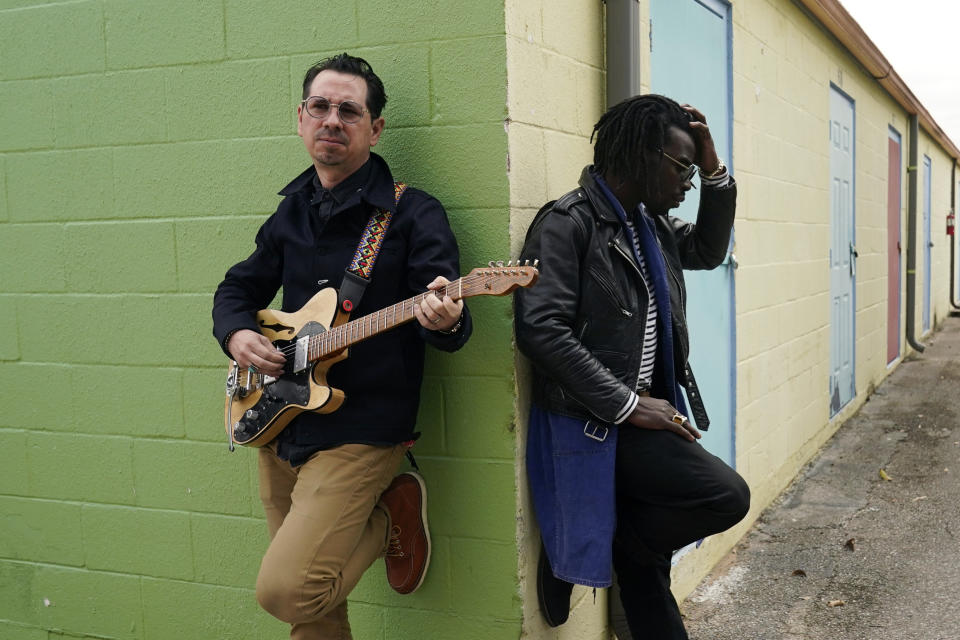 Adrian Quesada, right, and Eric Burton, of Black Pumas, pose for a portrait in Austin, Texas on Feb. 5, 2021. Their deluxe debut album is nominated for album of the year at the 2021 Grammy Awards and their single “Colors” is nominated for record of the year and best American roots performance. (AP Photo/Eric Gay)