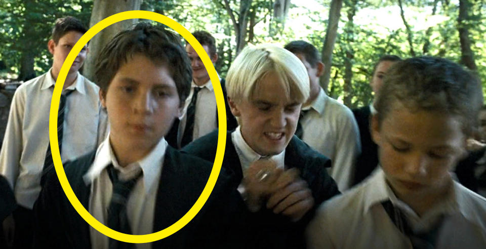 A young Tom circled and wearing a tie in a scene with other students