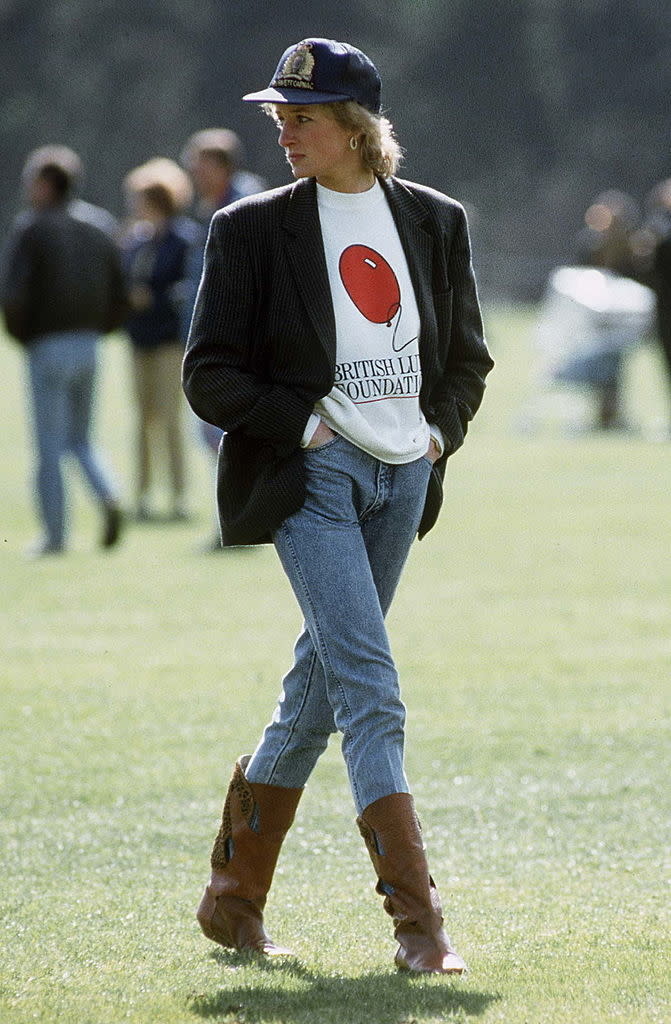 Diana, Princess Of Wales At Guards Polo Club. The Princess Is Casually Dressed In A Sweatshirt With The British Lung Foundation Logo On The Front, Jeans, Boots And A Baseball Cap