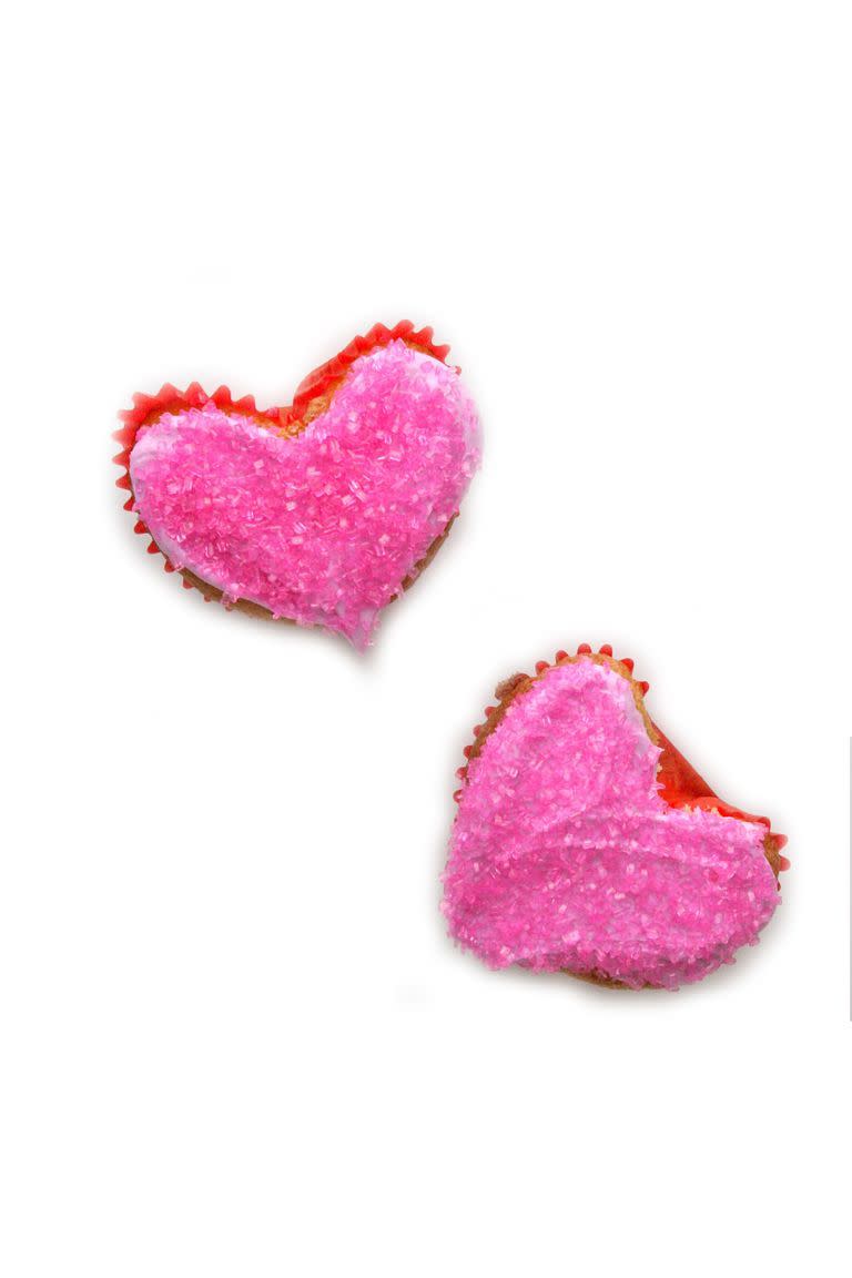 <p>These cupcakes are perfect for sharing with the whole family. And forget about buying a specialty cupcake pan — just mold your liners into the shape of hearts. </p><p><em><a href="https://www.womansday.com/food-recipes/food-drinks/recipes/a39866/heart-shaped-cupcakes-recipe-ghk0214/" rel="nofollow noopener" target="_blank" data-ylk="slk:Get the Heart-Shaped Cupcakes recipe.;elm:context_link;itc:0;sec:content-canvas" class="link ">Get the Heart-Shaped Cupcakes recipe.</a></em></p>