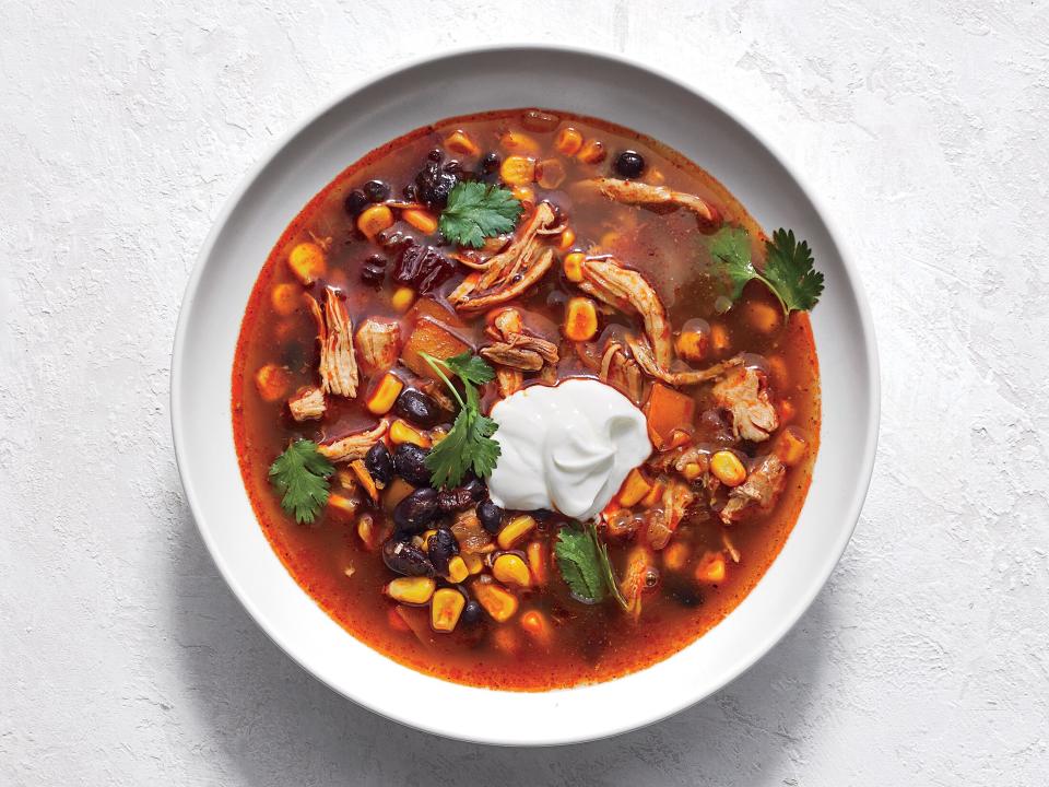 <p>This filling and flavorful soup is ideal for a chilly evening. Freeze leftover chipotle chiles and adobe sauce in a flattened Ziploc bag for future use. Want to make it in your Instant Pot? <a href="https://www.cookinglight.com/recipes/instant-pot-tex-mex-chicken-and-black-bean-soup" rel="nofollow noopener" target="_blank" data-ylk="slk:Click here for the recipe;elm:context_link;itc:0;sec:content-canvas" class="link ">Click here for the recipe</a>. </p> <p><a href="https://www.myrecipes.com/recipe/tex-mex-chicken-and-black-bean-soup" rel="nofollow noopener" target="_blank" data-ylk="slk:Slow Cooker Tex-Mex Chicken and Black Bean Soup Recipe;elm:context_link;itc:0;sec:content-canvas" class="link ">Slow Cooker Tex-Mex Chicken and Black Bean Soup Recipe</a></p>