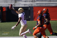 Purdue wide receiver Milton Wright, left, celebrate his touchdown reception as Illinois defensive back Sydney Brown (30) and Nate Hobbs watch during the first half of an NCAA college football game Saturday, Oct. 31, 2020, in Champaign, Ill. (AP Photo/Charles Rex Arbogast)