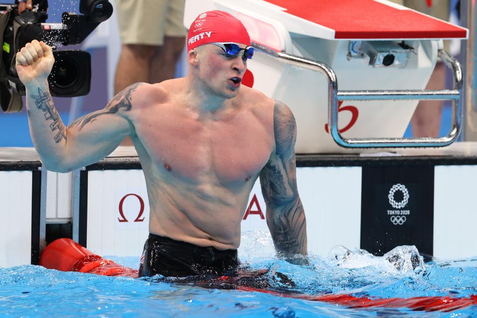 Adam Peaty wins 100m breaststroke gold at the Tokyo Olympics, the first Brit to defend a swimming title at the Games