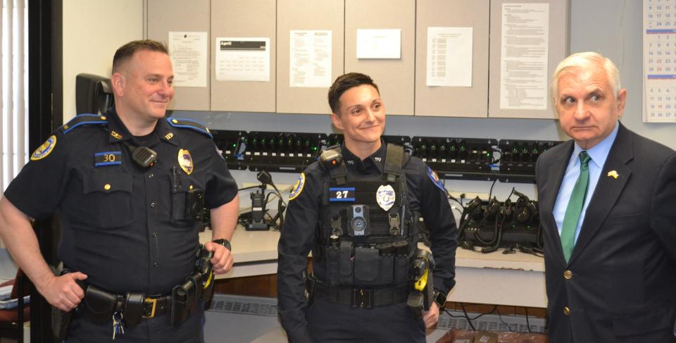 Sen. Jack Reed meets Officer Jaqueline Smaldone and Lt. John LeDuc during a tour of the Tiverton Police Department.