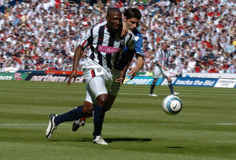 Kevin Campbell (L), playing for West Brom, attempts to get past Portsmouth defender Dejan Stefanovic (GLENN CAMPBELL)