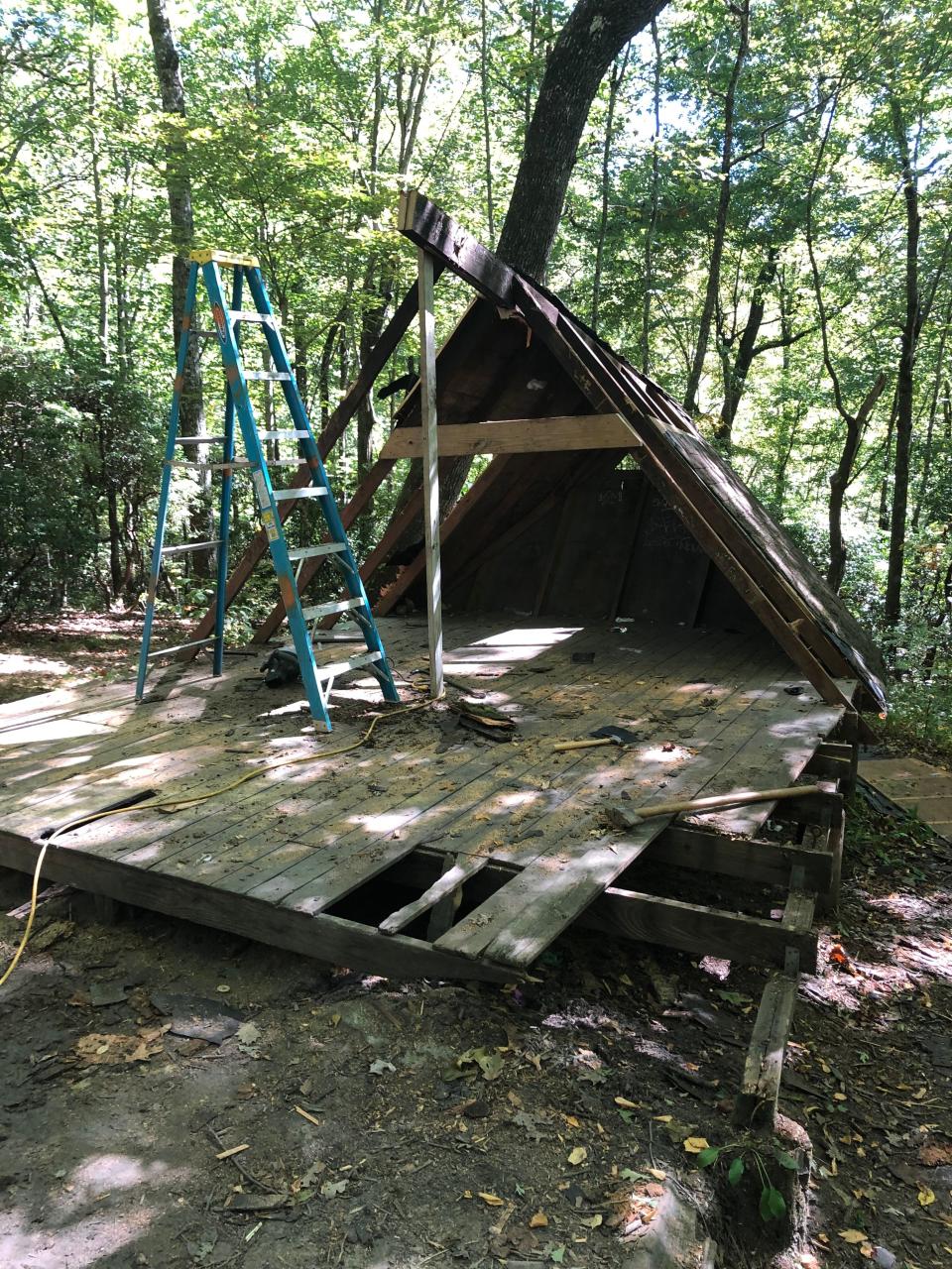 The old Butter Gap trail shelter on the Art Loeb Trail during demolition.