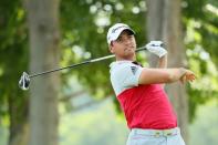 Australia's Jason Day watches his tee shot on the 15th hole during the first round of the 2016 PGA Championship at Baltusrol Golf Club on July 28, 2016